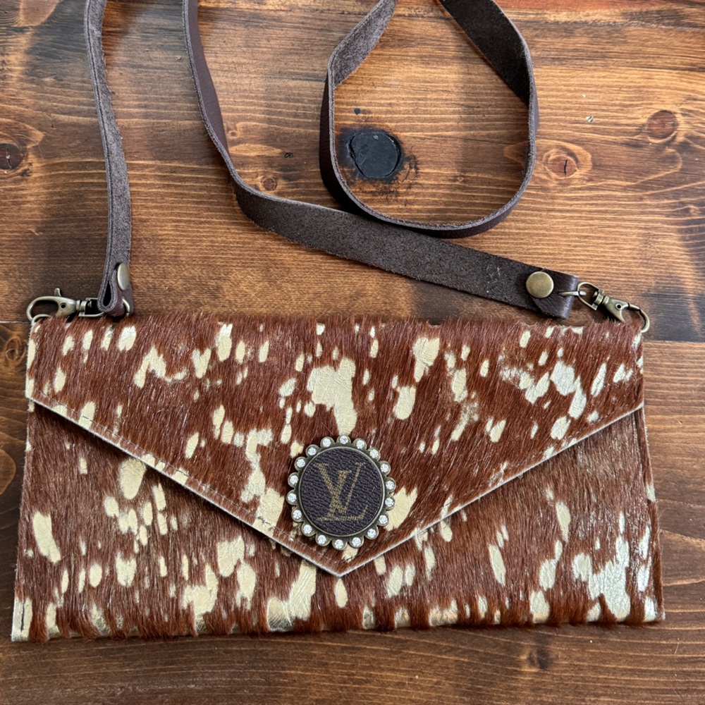 CUTE Cow hide crossbody with LV emblem